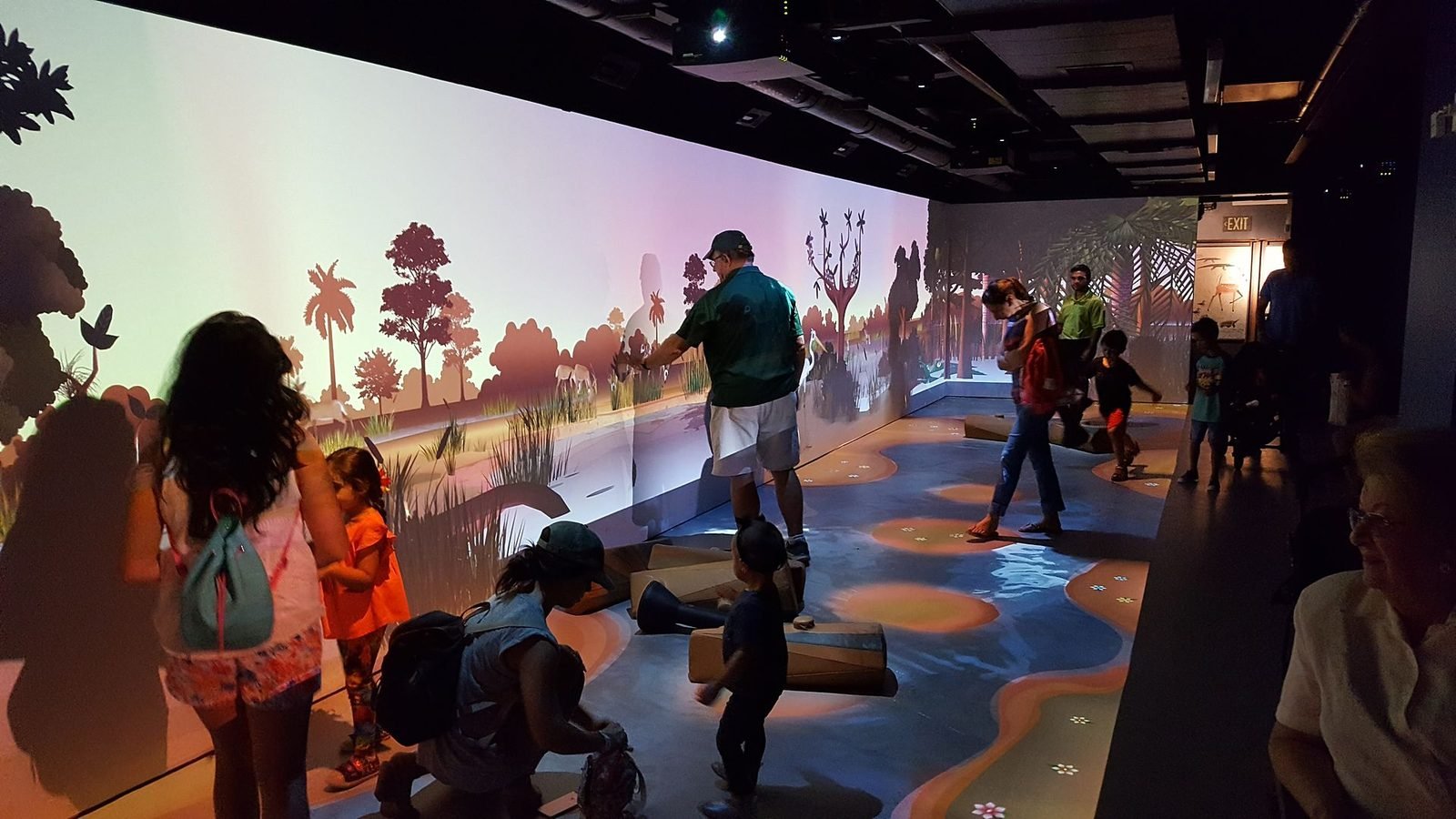 Children playing in an interactive projected forest installation